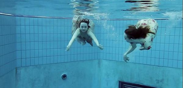  Two hot hairy beauties underwater